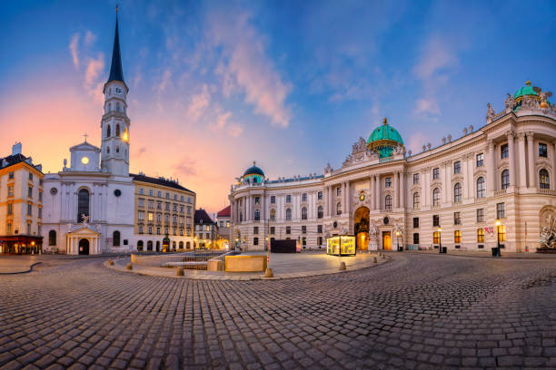 Cityscape image of Vienna, Austria with St. Michael’s Square during sunrise.
